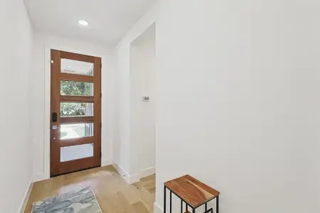 Doorway to outside with light hardwood / wood-style floors