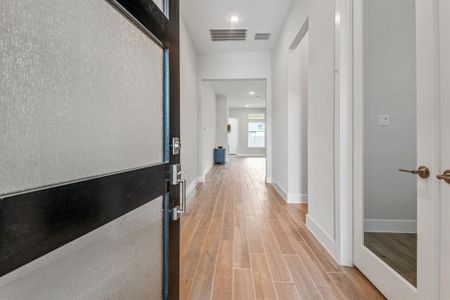 As you step through the entrance of this home, you are greeted by a spacious hallway that exudes a modern concept layout.