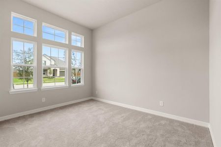 Your secondary bedroom features plush carpet, fresh paint, closet, and a large window that lets in plenty of natural lighting.