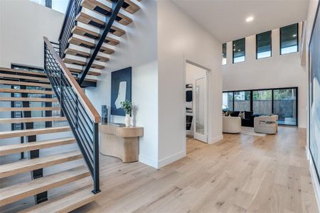 Stunning Entry with 2 Story Ceilings and Floating Staircase