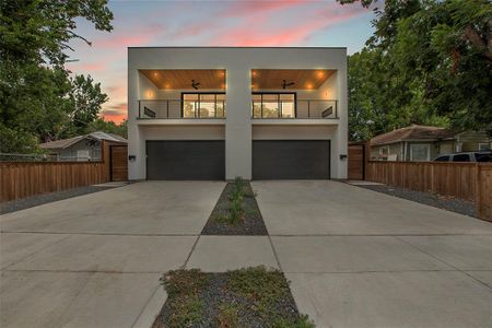 Contemporary home featuring a garage and a balcony