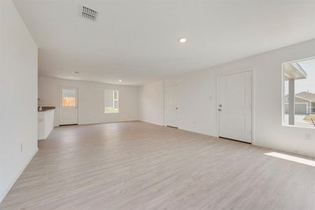 Unfurnished living room with light wood-type flooring