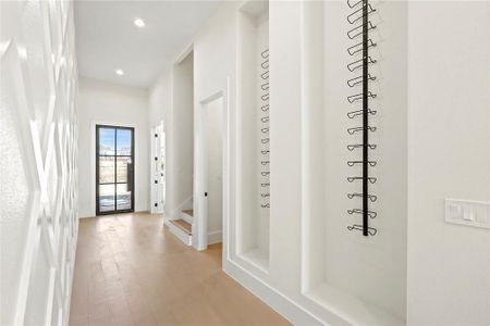 Hall featuring light hardwood / wood-style flooring