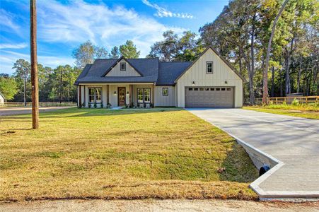 New construction Single-Family house 11386 Greenway Drive, Plantersville, TX 77363 - photo 0