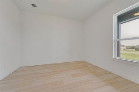 Unfurnished room featuring light wood-type flooring