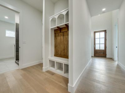 Mudroom with light wood-type flooring