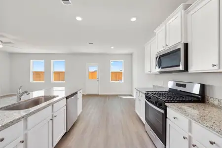 The kitchen is arguably one of the best features in the Mesquite because it has an incredible amount of counterspace and upgraded cabinets for storage, while maintaining an open view of the living space.