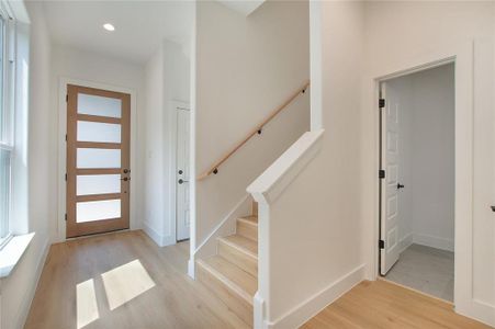 Entrance foyer featuring light hardwood / wood-style flooring