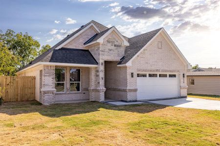 View of front of home featuring a garage and a front lawn