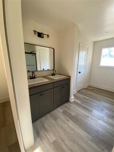 Bathroom featuring hardwood / wood-style floors and vanity