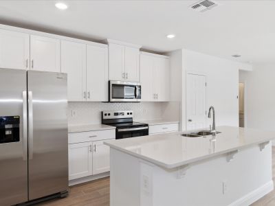 Kitchen in the Everglade floorplan at 232 Links Terrace Blvd