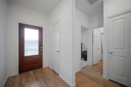 Entrance foyer featuring light wood-type flooring