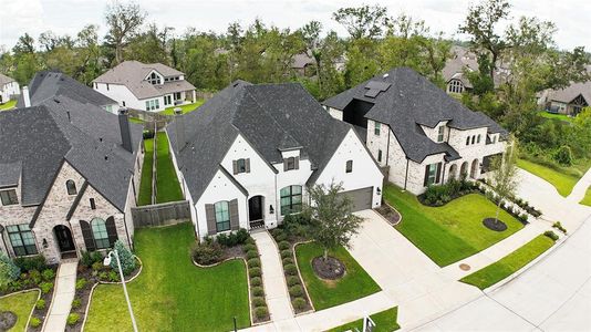 Finely crafted, the elegantly appointed brickwork entices the senses, while the charming stone-bordered flower beds add color and texture to the exterior.