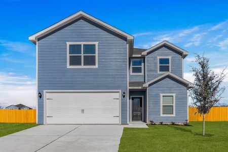 View of front of property with a front yard and a garage