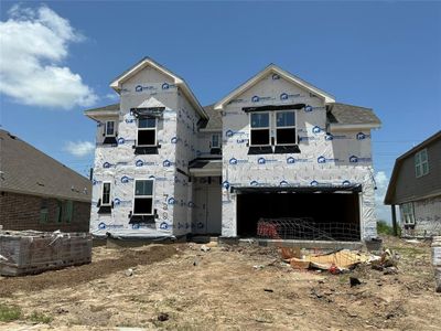 Two-story home with 5 bedrooms, 4.5 baths and 3 car tandem garage