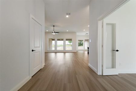 Hallway featuring hardwood / wood-style floors
