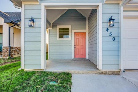 Entrance to property featuring a garage