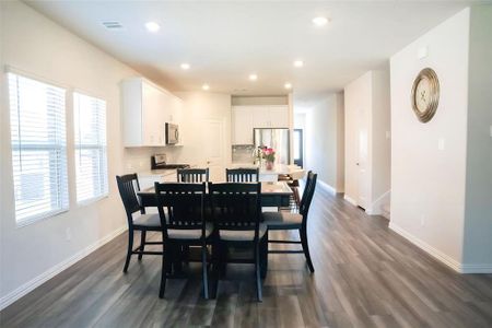 Dining area featuring dark hardwood / wood-style flooring