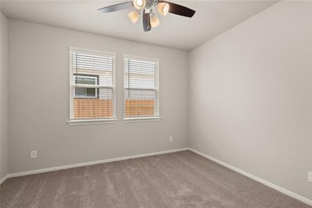 Your secondary bedroom features plush carpet, fresh paint, closet, and a large window that lets in plenty of natural lighting.