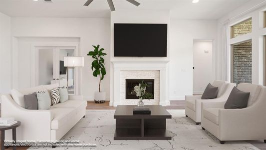 Living room featuring light hardwood / wood-style floors and ceiling fan