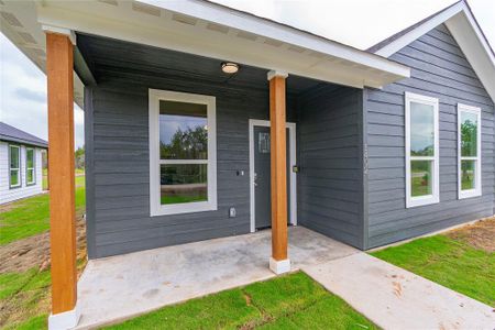 View of exterior entry with a porch