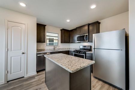 The kitchen of the Blanco plan comes completely chef-ready! Included in the kitchen, you will find sprawling granite countertops, oversized wood cabinetry, a full suite of energy-efficient Whirlpool® appliances and more.