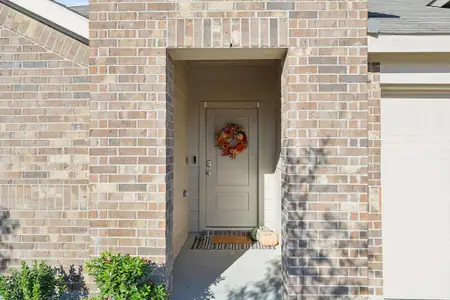 Doorway to property with a garage