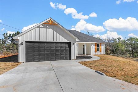 Modern inspired farmhouse with a garage