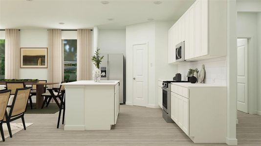 Kitchen featuring decorative backsplash, a kitchen breakfast bar, an island with sink, stainless steel appliances, and white cabinets