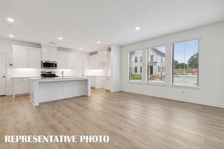 Wonderful family gatherings await in this lovely open concept dining area.  REPRESENTATIVE PHOTO