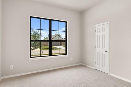 Your secondary bedroom features plush carpet, fresh paint, closet, and a large window that lets in plenty of natural lighting.