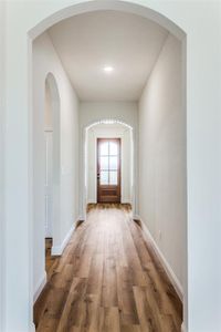 Doorway to outside featuring wood-type flooring