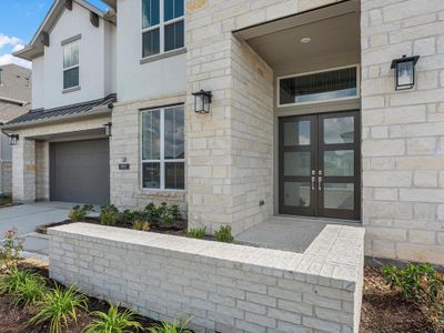 Step through an elegant entryway that sets the tone for luxury and sophistication, leading to gorgeous double doors that welcome you inside. This striking entrance combines style and grandeur, making an unforgettable first impression and offering a glimpse into the beautiful spaces that await within.