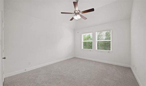 Owner's suite with slopped ceiling (*Photo not of actual home and used for illustration purposes only.)