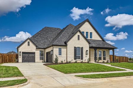 French country home with a front lawn