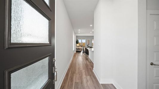 Walking in, you find a bright entryway with beautiful light wood like flooring that into the main living areas making it easy to clean and maintain.