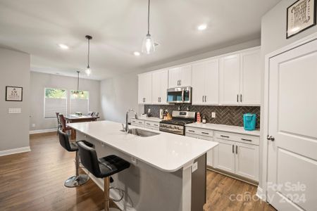 Spacious white kitchen with walk-in pantry