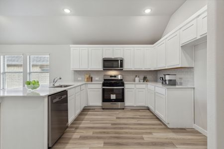 Kitchen in the Jade II home plan by Trophy Signature Homes – REPRESENTATIVE PHOTO