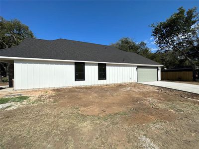 View of property exterior with a garage