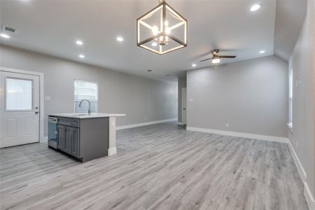 The living room is open to the kitchen and dining room for a grander feel.