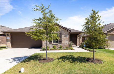 View of front of house with a garage and a front yard