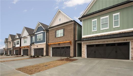 New construction Townhouse house 5546 Leyland Drive, Flowery Branch, GA 30542 - photo 0