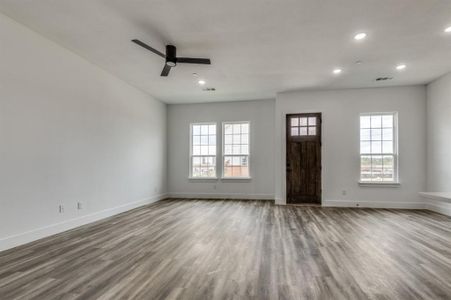 Entrance foyer featuring plenty of natural light, light hardwood / wood-style floors, and ceiling fan