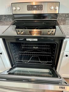 Kitchen featuring stainless steel electric stove