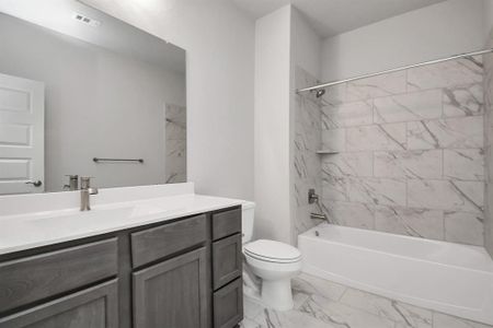 Guest suite bath on 1st floor. Sample photo of completed home with similar floor plan. Actual colors and selections may vary.