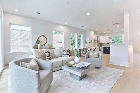 Spacious and sunlit open-concept living area, perfect for entertaining and relaxation.