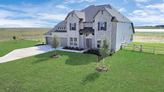 Approaching the front door you will see the landscaping and brick exterior.