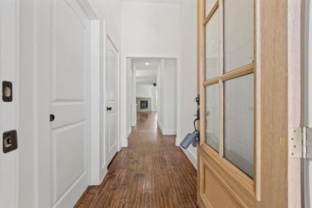 Hall featuring dark hardwood / wood-style flooring