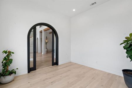 Spare room with light wood-type flooring