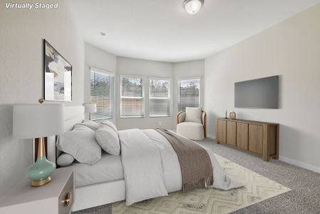 The primary bedroom of a home in Stewart's Ranch in Conroe, TX.